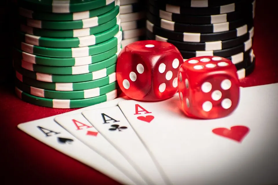 Poker chips and cards on a table at Strategy & Club.